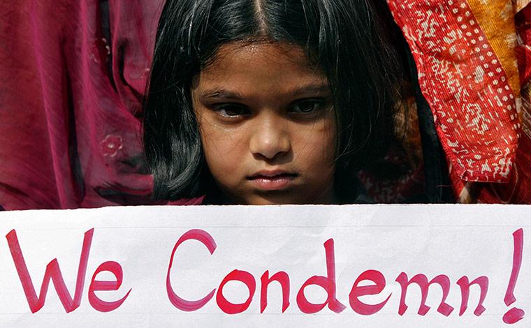 a girl holds a placard on a protest rally in the southern city of hyderabad in india photo reuters file