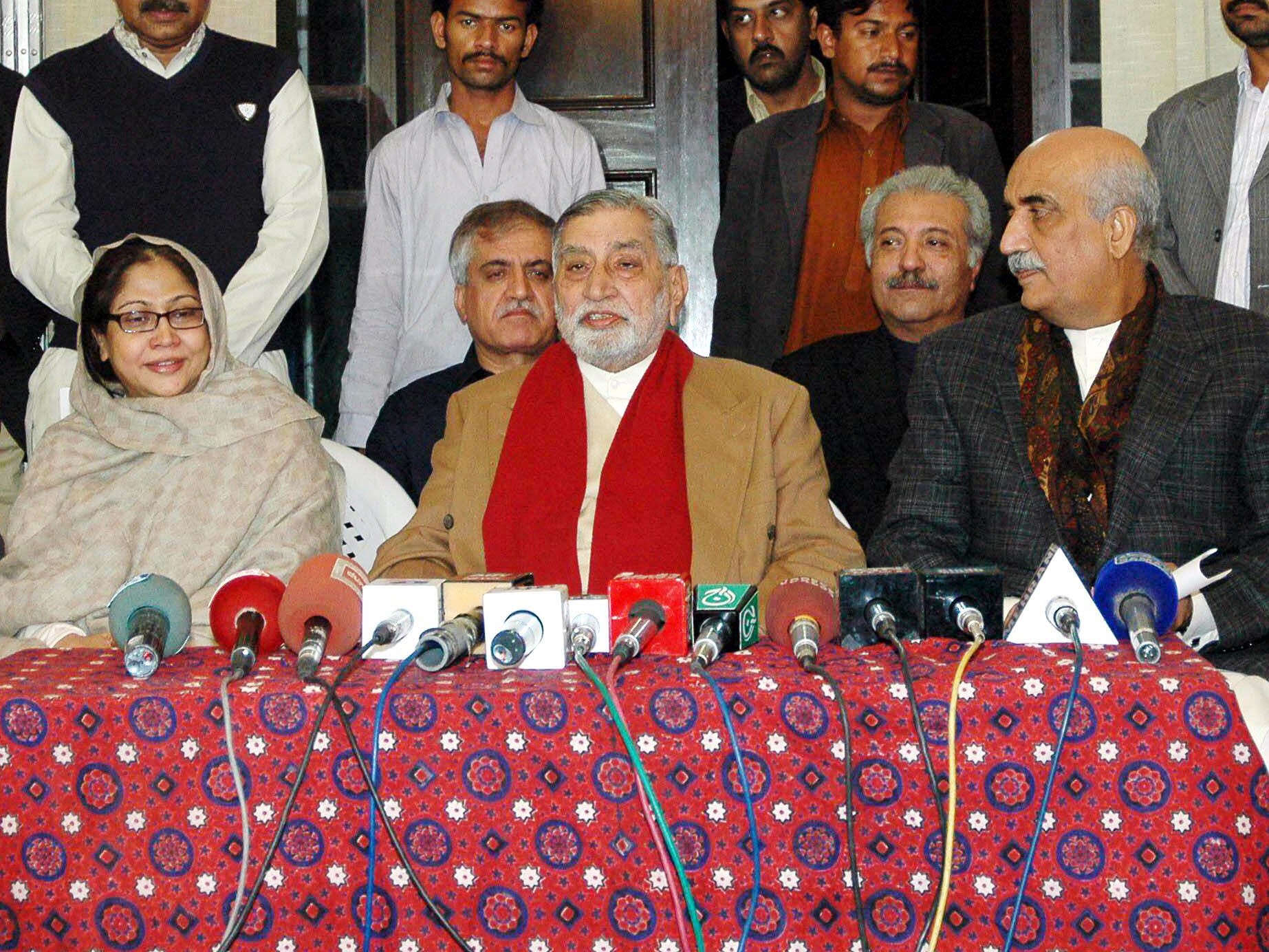 raja afzal c announcing his decision to join ppp flanked by senior ppp leaders feryal talpur l and khurshid shah r photo mohammad noman express