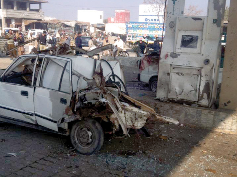 due to cng cylinder explosion at a filling station on gt road the rear of a car along with its roof have been badly damaged photo express