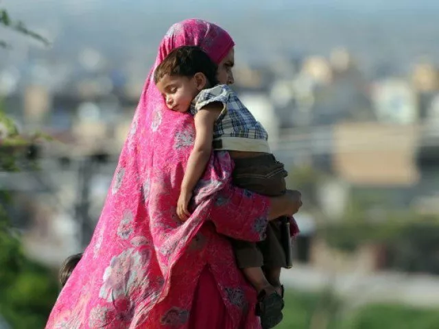 a pakistani woman carries her son as she walk on a street in islamabad on may 13 2012 on mother 039 s day photo afp a pakistani woman carries her son as she walk on a street in islamabad on may 13 2012 on mother 039 s day photo afp