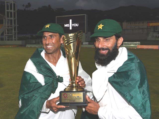 retiring pakistan cricket team members younis khan l and captain misbah ul haq r celebrate with the series trophy after winning the final test match and the series 2 1 against the west indies at the windsor park stadium in roseau dominica on may 14 2017 photo afp