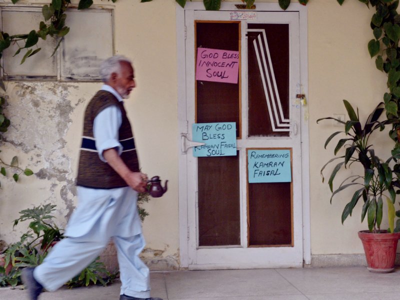 a man walks past the room formerly occupied by kamran faisal photo afp