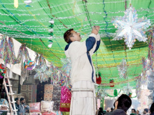 a man decorates a street in gujranwala s rail bazaar for rabiul awal 12 photo khurram shahzad express