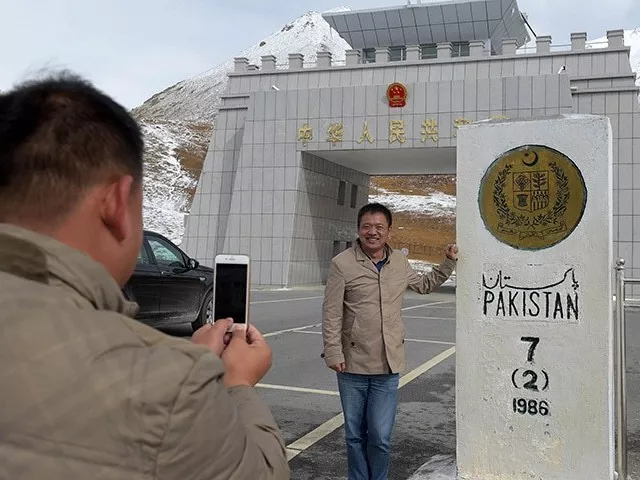 in this photograph taken on september 29 2015 a chinese national takes a photograph of his colleague at the pak china khunjerab pass the world 039 s highest paved border crossing at 4 600 metres above sea level photo afp in this photograph taken on september 29 2015 a chinese national takes a photograph of his colleague at the pak china khunjerab pass the world 039 s highest paved border crossing at 4 600 metres above sea level photo afp