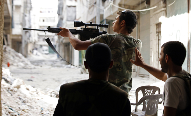 a free syrian army fighter points his weapon during clashes with forces loyal to syria 039 s president bashar al assad in aleppo 039 s al amereya district photo reuters file