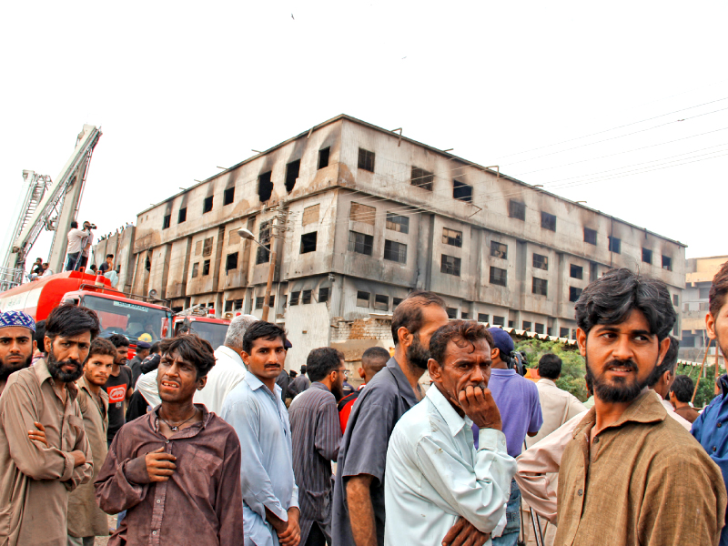 family members gathered outside the factory after the fire hoping for some good news file photo ayesha mir express