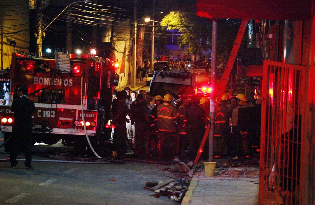 firefighters work at a nightclub in santa maria 550 km from porto alegre southern brazil on january 27 2012 photo afp