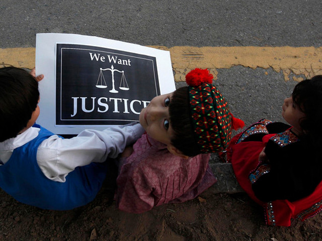 children sit with a placard on a roadside during a protest by members of a civil society against the rape of a five year old girl in lahore photo reuters children sit with a placard on a roadside during a protest by members of a civil society against the rape of a five year old girl in lahore photo reuters