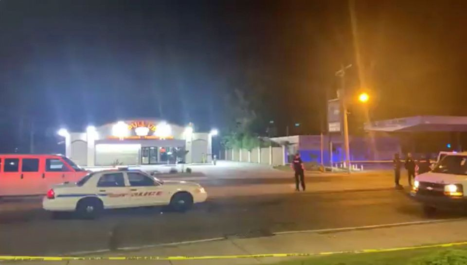 police personnel and their vehicles are seen near the scene in the aftermath of a drive by shooting at a liquor store in shreveport louisiana u s april 18 2021 in this still image from video obtained via social media reuters