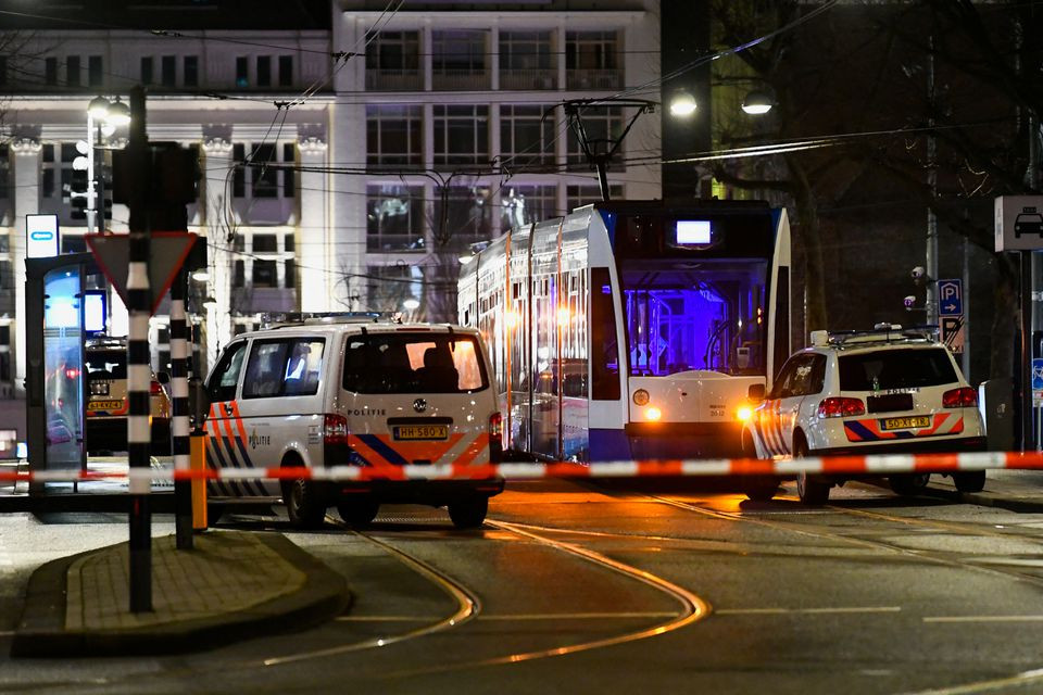 police vehicles are seen near an apple store in central amsterdam during a hostage incident in the store in amsterdam netherlands february 22 2022 reuters