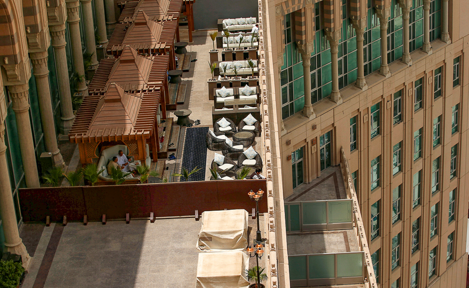 Visitors sit on the roof of hotel outside the Grand mosque ahead of Hajj. PHOTO: REUTERS