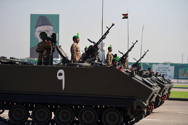 Pakistani tank crews steer their vehicles during the Pakistan Day military parade in Islamabad on March 23, 2018. PHOTO: AFP