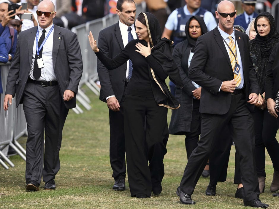 New Zealand's Prime Minister Jacinda Ardern waves as she departs following a gathering for congregational Friday prayers and two minutes of silence for victims of the twin mosque massacre, at Hagley Park in Christchurch. PHOTO: AFP