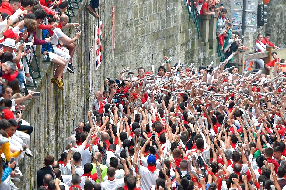 Participants sing before the start of the third bullrun. PHOTO: AFP