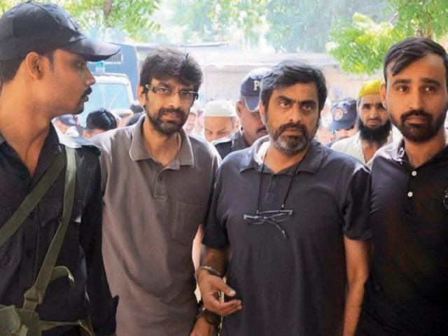shahid bhaila left and arshad bhaila right owners of the ill fated factory in baldia returning from a court hearing photo file