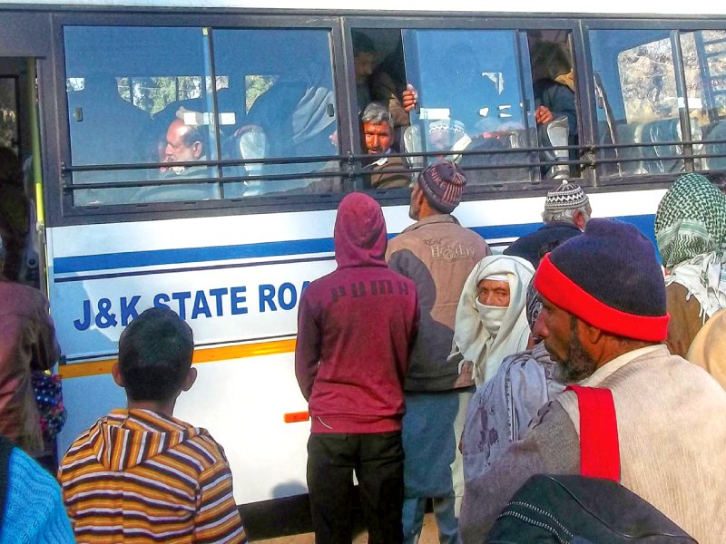 passengers board a jammu and kashmir state government bus at an outpost near poonch photo afp