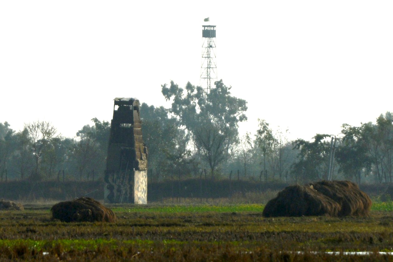 an indian watch tower front l and a pakistani observation post back r at the india pakistan border near jammu photo afp