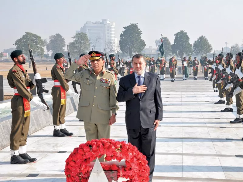 afghan defence minister general bismillah khan mohammadi flanked by general ashfaq parvez kayani lays a wreath at yadgar e shuhada at general headquarters photo courtesy ispr afghan defence minister general bismillah khan mohammadi flanked by general ashfaq parvez kayani lays a wreath at yadgar e shuhada at general headquarters photo courtesy ispr