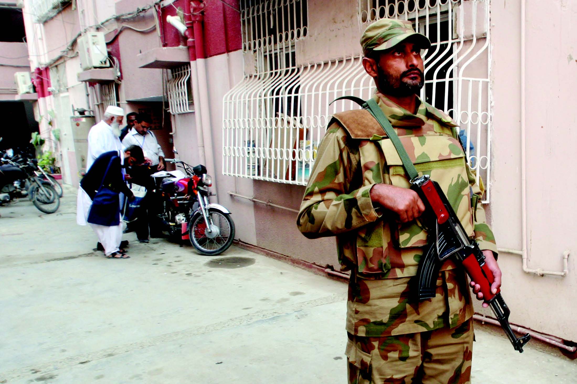 after protests by opposition parties the election commission has asked the army to send in more troops to help the enumerators with the voter verifications the army was present in gulshan e iqbal block 13 d on tuesday photo athar khan express