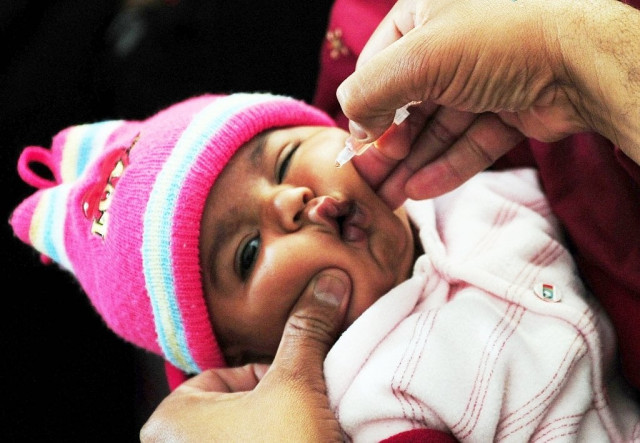 a pakistani health worker administers polio vaccine drops to a young child at a polio vaccination center in karachi photo afp file a pakistani health worker administers polio vaccine drops to a young child at a polio vaccination center in karachi photo afp file