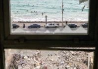 people who returned home after displacement during the war swim in front of the rubble of buildings destroyed in israeli strikes in tyre southern lebanon photo reuters