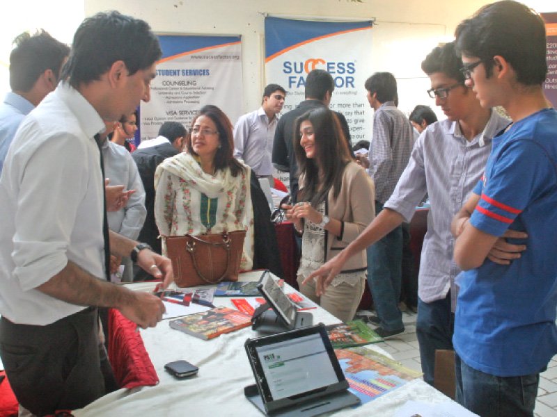 high school students question representatives from universities and companies at the career expo photo express