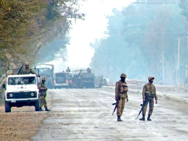 troops patrol near the military camp following the militant attack in lakki marwat district photo afp troops patrol near the military camp following the militant attack in lakki marwat district photo afp