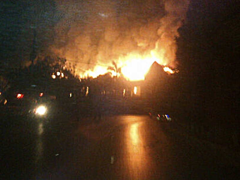 this cell phone photo shows flames reaching high in to the karachi night sky as the building burns photo atika rehman express tribune