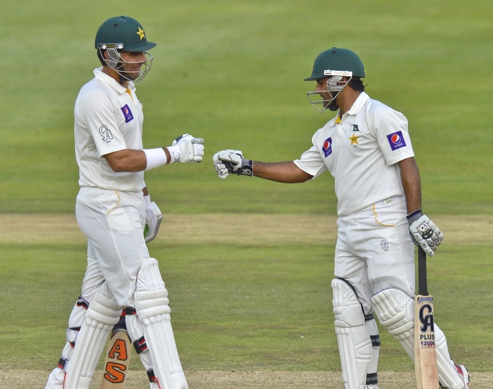 asad shafiq and misbah ul haq celebrate their 100 partnership on day three of the first test match between south africa and pakistan in johannesburg at wanderers stadium on february 3 2013 photo afp
