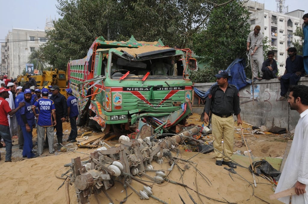 a young man was crushed to death on sunday by a speeding dumper truck outside a roadside auto repair shop in dhoraji photo mohammad azeem express