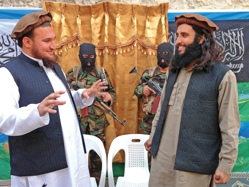 ttp spokesman ehsanullah ehsan talks with new member adnan rasheed photo afp