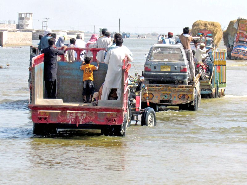 flood affected villagers evacuate dera allah yar in balochistan photo afp file