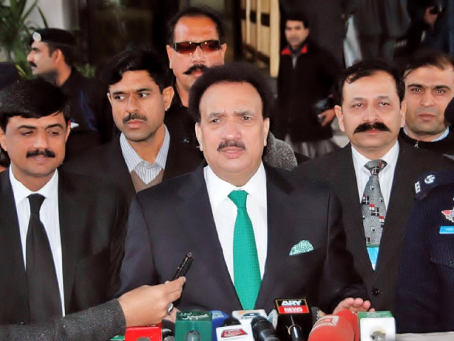 interior minister rehman malik talking to the media outside the supreme court photo nni