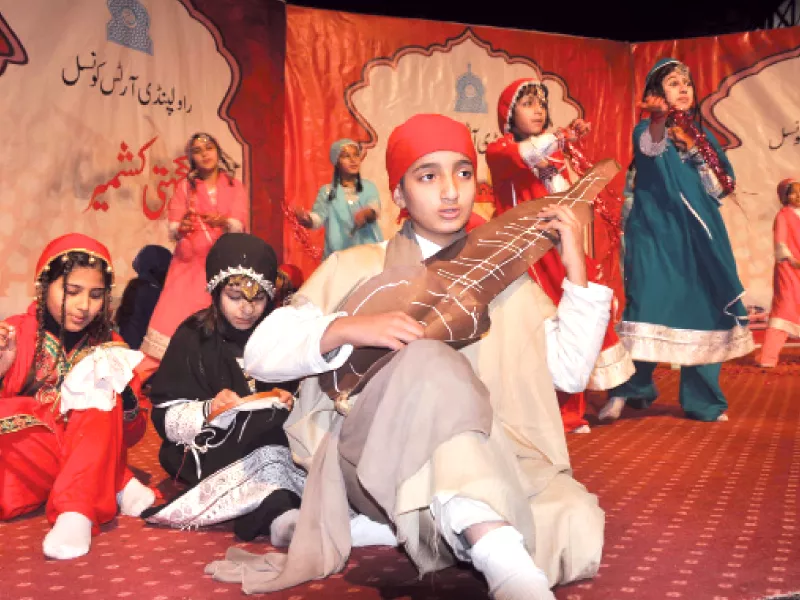 students performing folk tunes and dance at rac top kashmiri dolls and handicrafts on display at lok virsa photo express students performing folk tunes and dance at rac top kashmiri dolls and handicrafts on display at lok virsa photo express