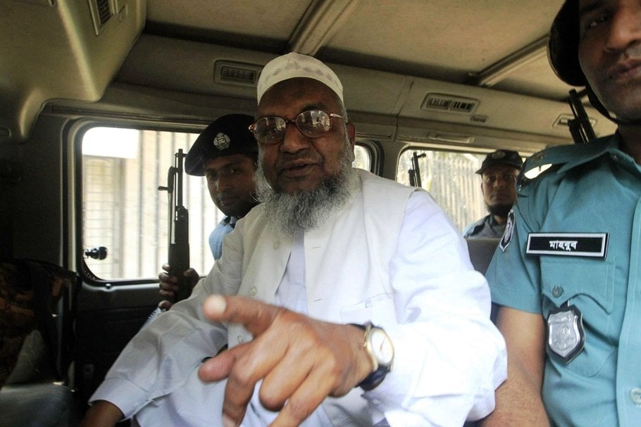 bangladesh 039 s jamaat e islami leader abdul quader mollah gestures as he talks from a police van after a war crimes tribunal sentenced him to life imprisonment in dhaka photo reuters