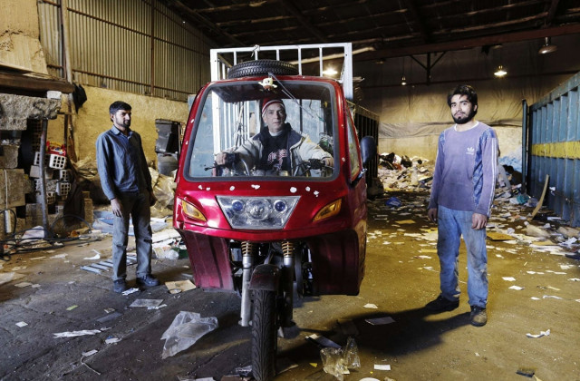 greek dimitris c 56 poses inside his three wheeler with his fellow scrap dealers pakistani naim muhammad r 25 and abdel malek l 22 at a scrap weigh station in athens photo reuters greek dimitris c 56 poses inside his three wheeler with his fellow scrap dealers pakistani naim muhammad r 25 and abdel malek l 22 at a scrap weigh station in athens photo reuters