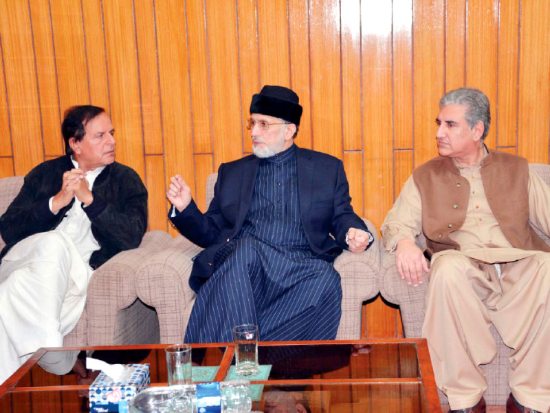 tahirul qadri talks with pti leaders javed hashmi and shah mehmood qureshi in lahore on wednesday photo ppi