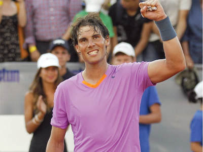 nadal secures victory in singles return