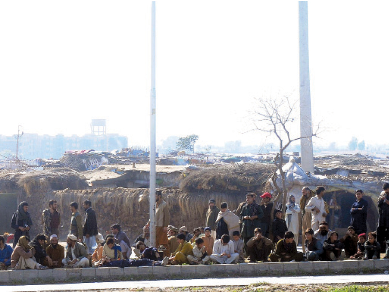 the residents of afghan basti in sector i 11 resist eviction notices served by cda photo express