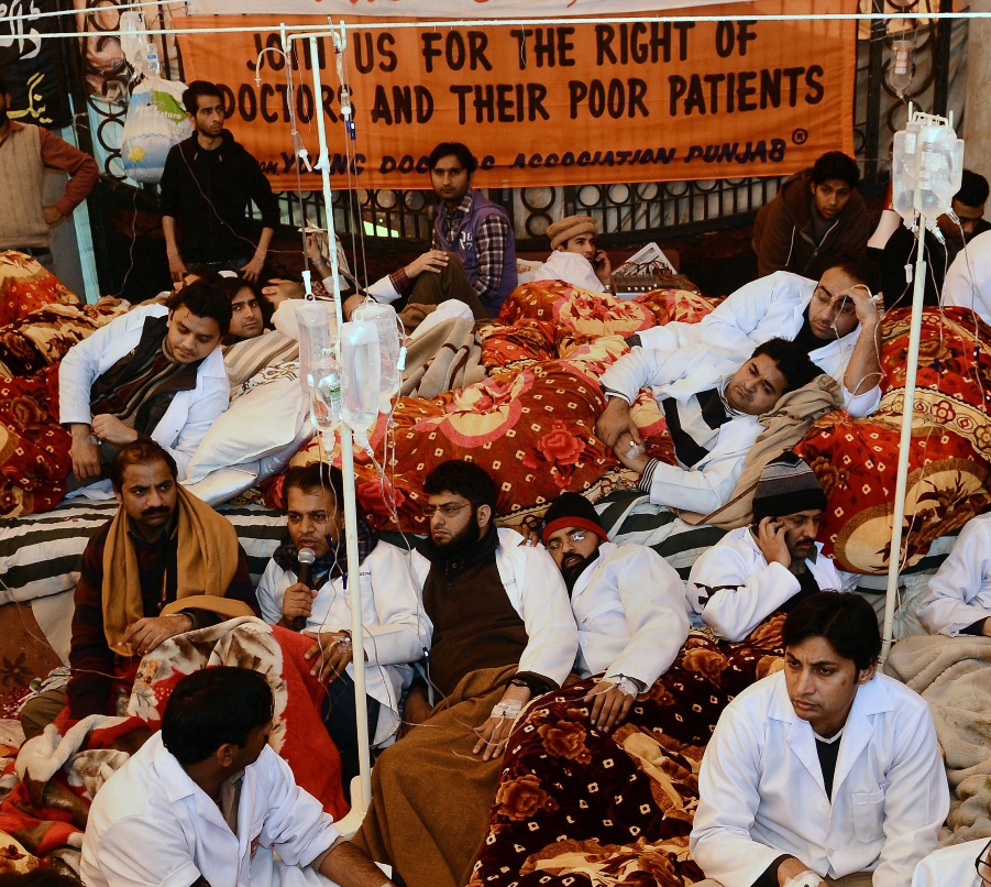 members of the pakistani young doctors association yda sit on a hunger strike at their protest camp in lahore photo afp