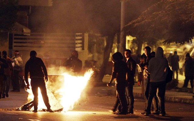 protesters who oppose egyptian president mohamed mursi make a fire to close a road during clashes with riot police in front of the presidential palace in cairo february 8 2013 photo reuters