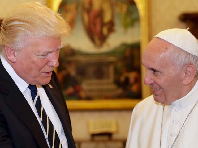 pope francis exchanges gifts with president donald trump during a private audience at the vatican photo afp