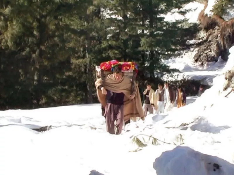villagers on foot carrying a relative in need of medical care photo express villagers on foot carrying a relative in need of medical care photo express