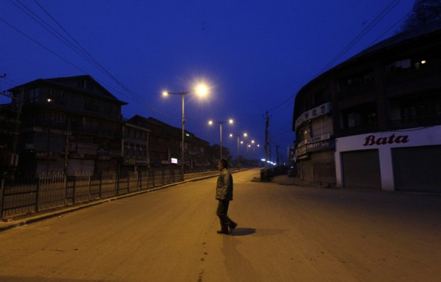 an indian policeman patrols a deserted road during a curfew in srinagar february 11 2013 photo reuters an indian policeman patrols a deserted road during a curfew in srinagar february 11 2013 photo reuters