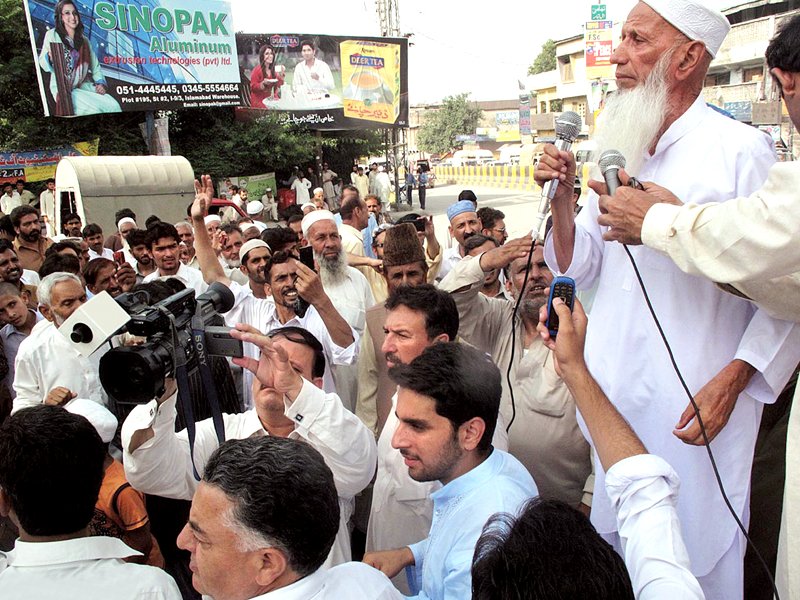 a leader of tehreek e suba hazara party speaks during a demonstration at fawara chowk in abbottabad photo online