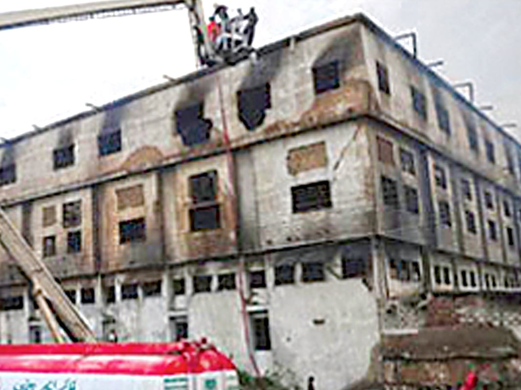 a file photo of the garment factory in baldia town karachi where a fire left more than 250 people dead photo file