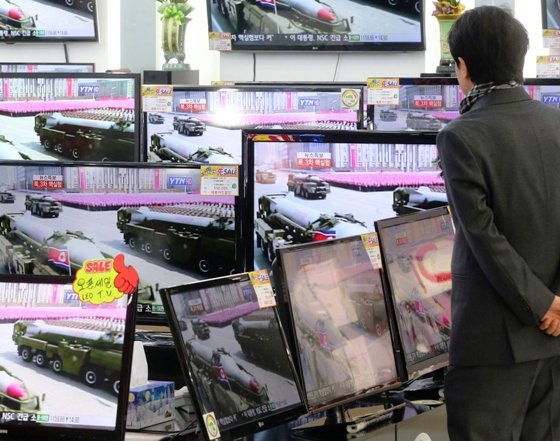 a customer look at television sets showing a report on north korea 039 s nuclear test at an electronics shop in seoul february 12 2013 photo reuters