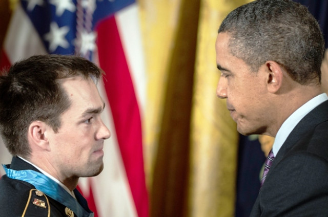us president barack obama thanks us army staff sargent clinton romesha during a medal of honor ceremony in the east room of the white house february 11 2013 photo afp us president barack obama thanks us army staff sargent clinton romesha during a medal of honor ceremony in the east room of the white house february 11 2013 photo afp