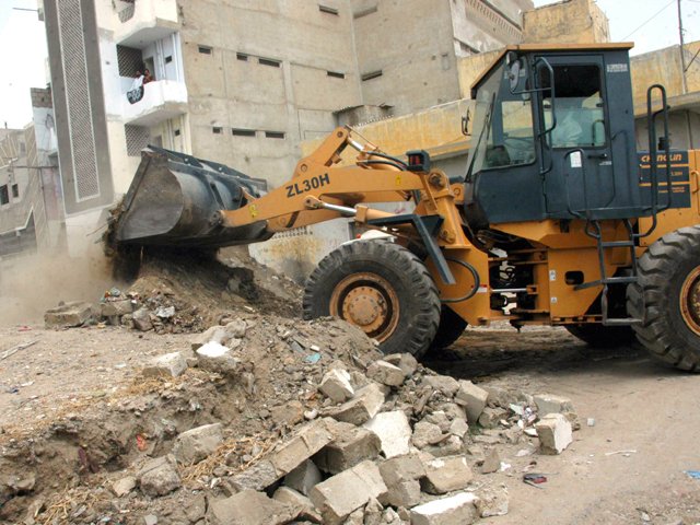 the authorities demolished several illegal cabins and encroachments by shopkeepers along with confiscating carts placed on the roadside photo file