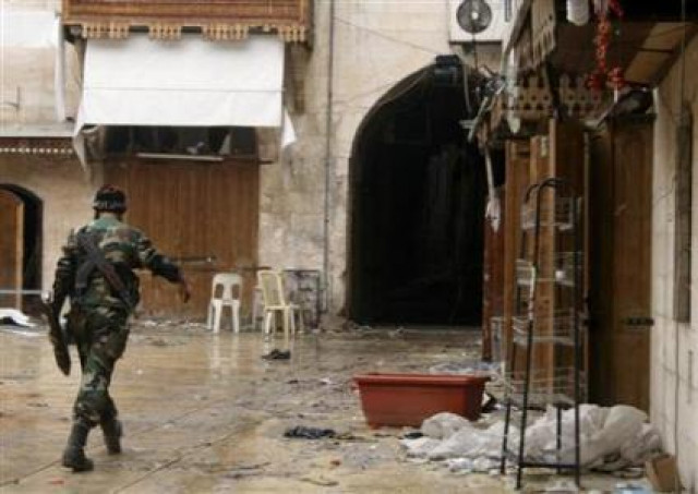 a free syrian army fighter walks in the old city of aleppo february 11 2013 photo reuters a free syrian army fighter walks in the old city of aleppo february 11 2013 photo reuters